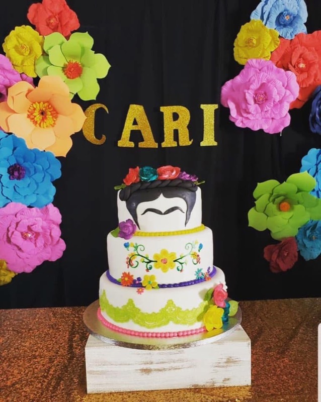 Frida Kahlo themed tiered cake with paper flowers